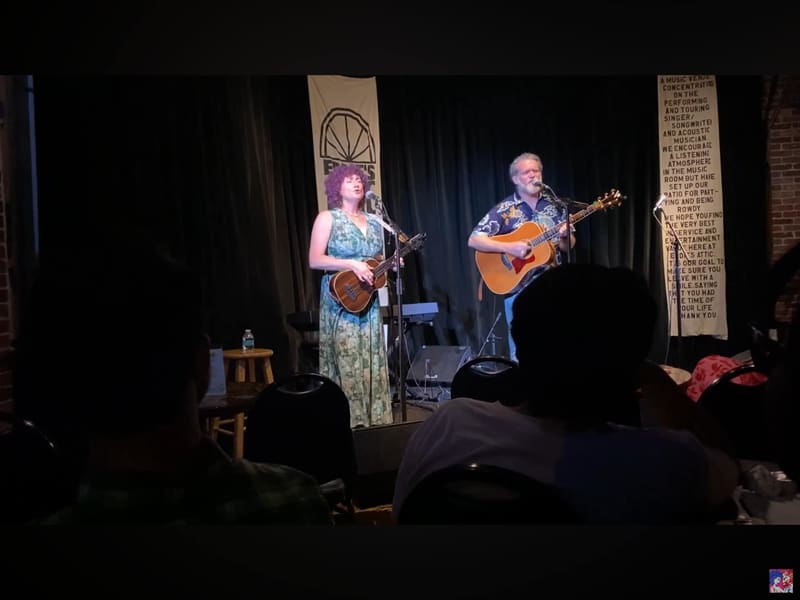 The duo on the small stage at Eddie's Attic in front of a seated room